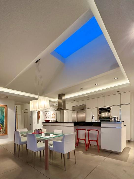 A large skylight introduces the night sky into the interior of the C House.